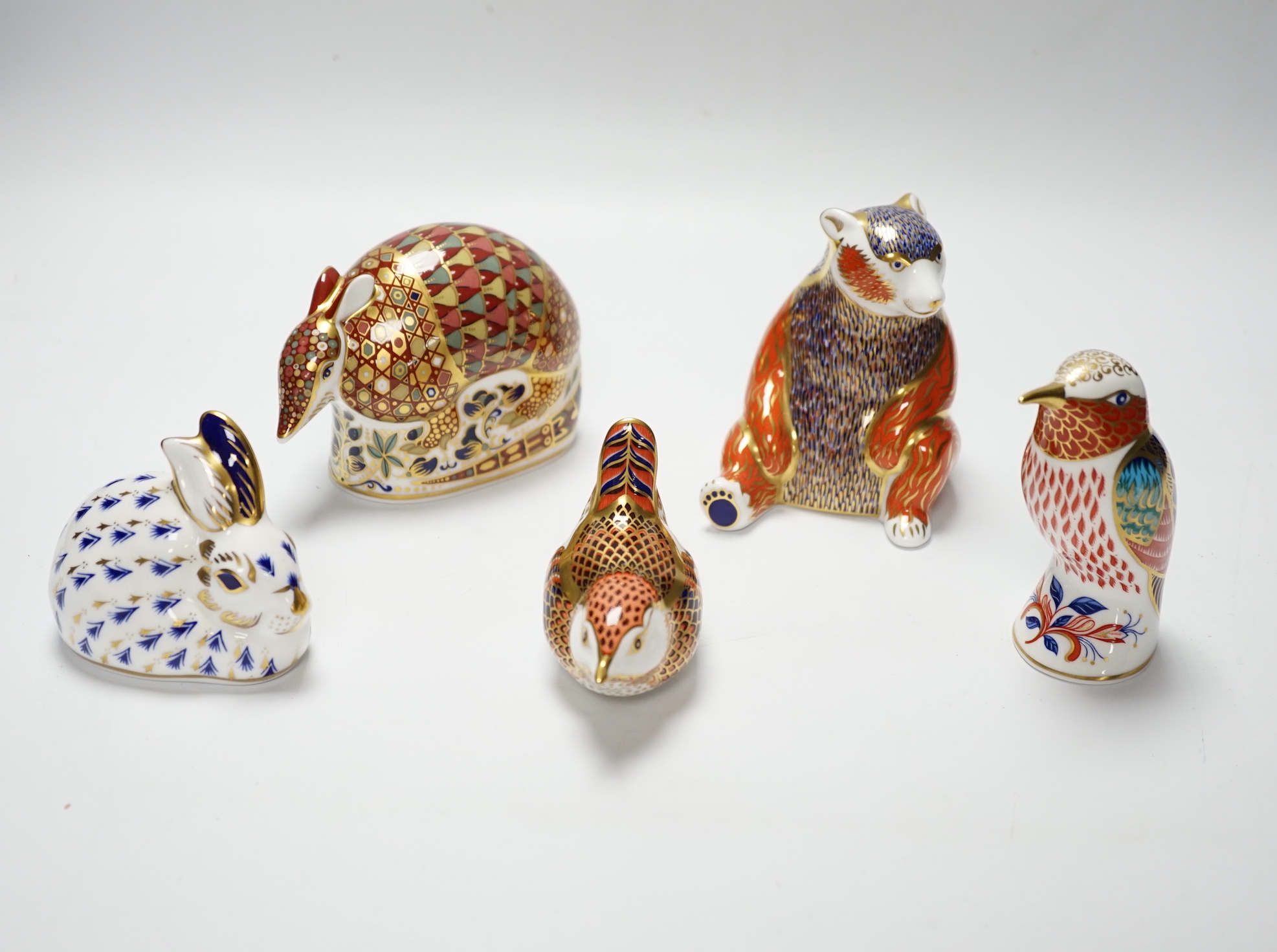 A collection of five Royal Crown Derby animal and bird paperweights